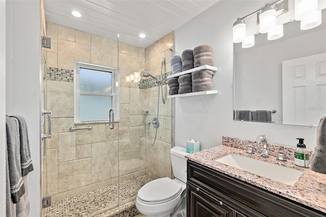 809 E 14th Ave, New Smyrna Beach, FL 32169 - bathroom featuring vanity, toilet, a shower stall, and recessed lighting