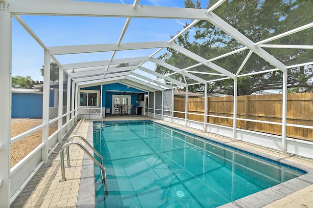 809 E 14th Ave, New Smyrna Beach, FL 32169 - view of swimming pool with glass enclosure and a patio area