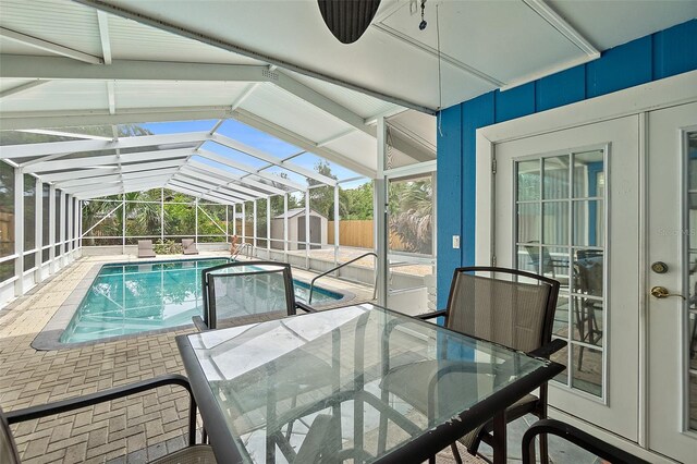809 E 14th Ave, New Smyrna Beach, FL 32169 - swimming pool with a patio, outdoor dining area, and glass enclosure