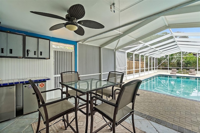 809 E 14th Ave, New Smyrna Beach, FL 32169 - view of pool with a patio area, a swimming pool, a ceiling fan, and glass enclosure