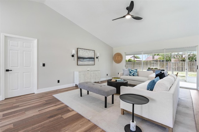 23 Forest Hill Dr, Palm Coast, FL 32137 - living area with high vaulted ceiling, baseboards, a ceiling fan, and wood finished floors