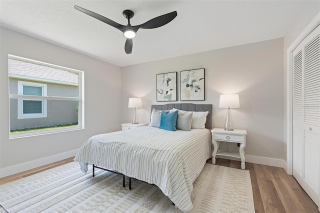 23 Forest Hill Dr, Palm Coast, FL 32137 - bedroom featuring baseboards, wood finished floors, a closet, and ceiling fan