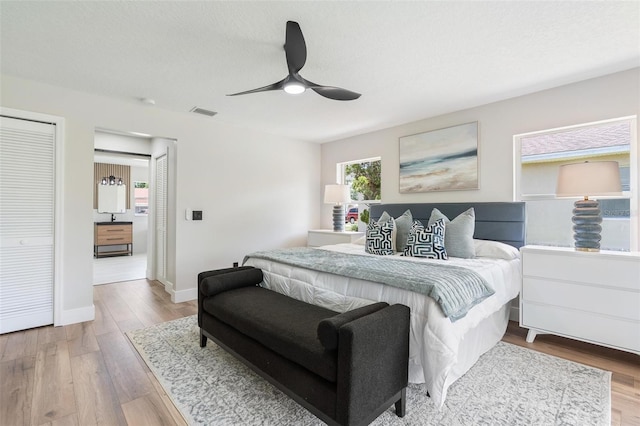 23 Forest Hill Dr, Palm Coast, FL 32137 - bedroom with wood finished floors, baseboards, and a ceiling fan