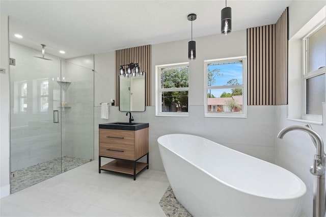 23 Forest Hill Dr, Palm Coast, FL 32137 - bathroom with vanity, a shower stall, a soaking tub, and recessed lighting