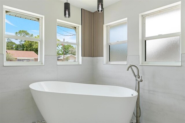 23 Forest Hill Dr, Palm Coast, FL 32137 - bathroom with a freestanding bath