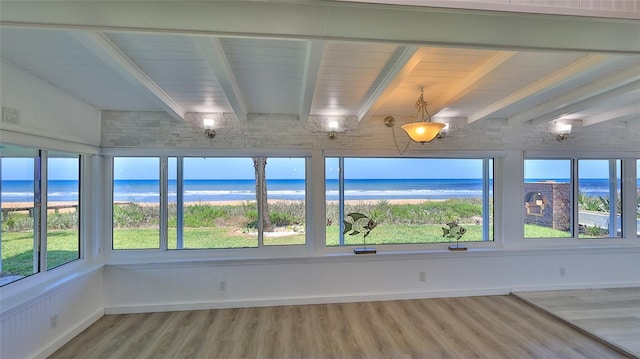 8 Ocean Dunes Dr, Ormond Beach, FL 32176 - spare room with view of water and beach, beam ceiling, and light wood-style floors