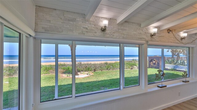 8 Ocean Dunes Dr, Ormond Beach, FL 32176 - detailed view of beamed ceiling, view of water and beach, and wood finished floors
