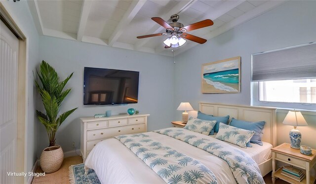 8 Ocean Dunes Dr, Ormond Beach, FL 32176 - bedroom featuring beamed ceiling, carpet floors, and ceiling fan