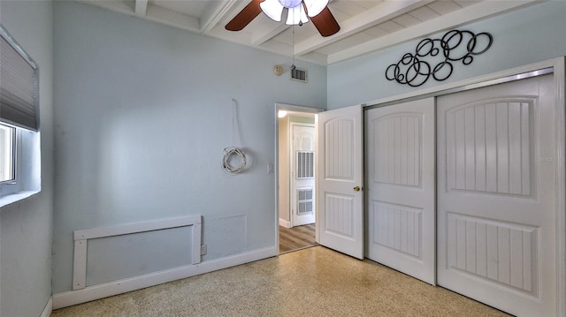 8 Ocean Dunes Dr, Ormond Beach, FL 32176 - unfurnished bedroom featuring beamed ceiling, speckle patterned floor, a closet, baseboards, and ceiling fan