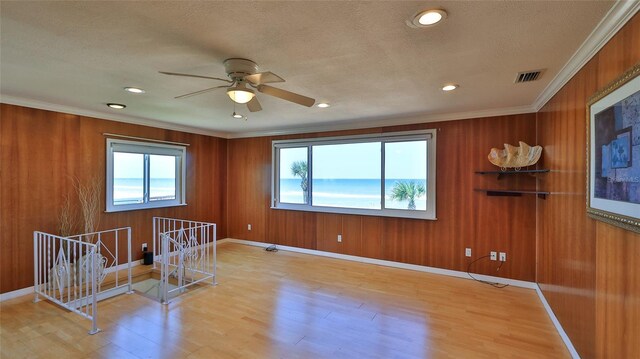 8 Ocean Dunes Dr, Ormond Beach, FL 32176 - unfurnished room featuring light wood-style floors, a ceiling fan, crown molding, baseboards, and recessed lighting