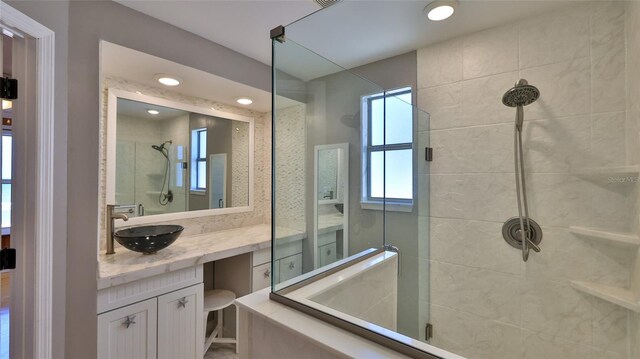 8 Ocean Dunes Dr, Ormond Beach, FL 32176 - bathroom with a shower stall, vanity, and recessed lighting