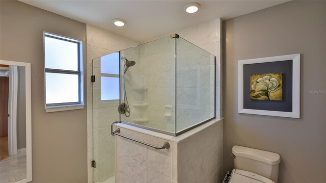8 Ocean Dunes Dr, Ormond Beach, FL 32176 - bathroom featuring a stall shower and toilet
