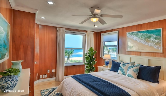 8 Ocean Dunes Dr, Ormond Beach, FL 32176 - bedroom with ornamental molding, wood finished floors, recessed lighting, wooden walls, and a ceiling fan