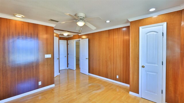 8 Ocean Dunes Dr, Ormond Beach, FL 32176 - unfurnished bedroom featuring light wood finished floors, crown molding, baseboards, recessed lighting, and ceiling fan