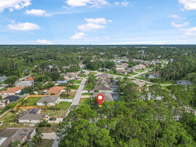 aerial view of property's location with nearby suburban area