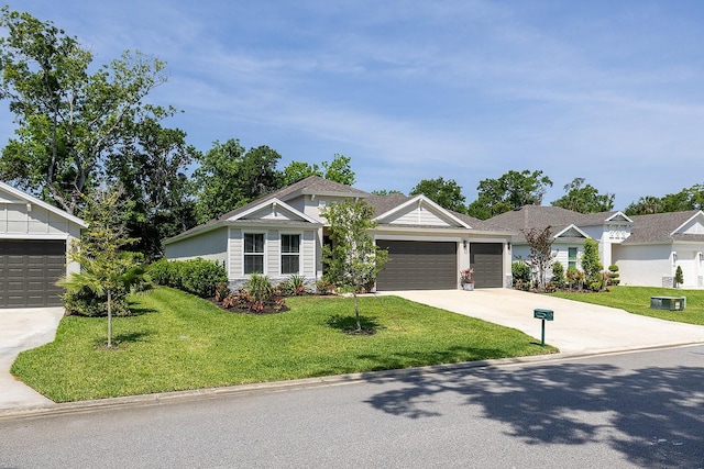 3026 Adrian Dr, Ormond Beach, FL 32174 - view of front of home with an attached garage, concrete driveway, and a front lawn
