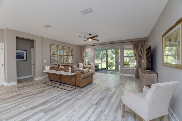3026 Adrian Dr, Ormond Beach, FL 32174 - living area with light wood-style flooring, baseboards, and ceiling fan