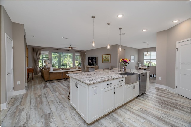 3026 Adrian Dr, Ormond Beach, FL 32174 - kitchen featuring a sink, stainless steel dishwasher, open floor plan, healthy amount of natural light, and recessed lighting