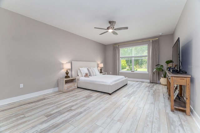 3026 Adrian Dr, Ormond Beach, FL 32174 - bedroom featuring light wood-type flooring, baseboards, and a ceiling fan