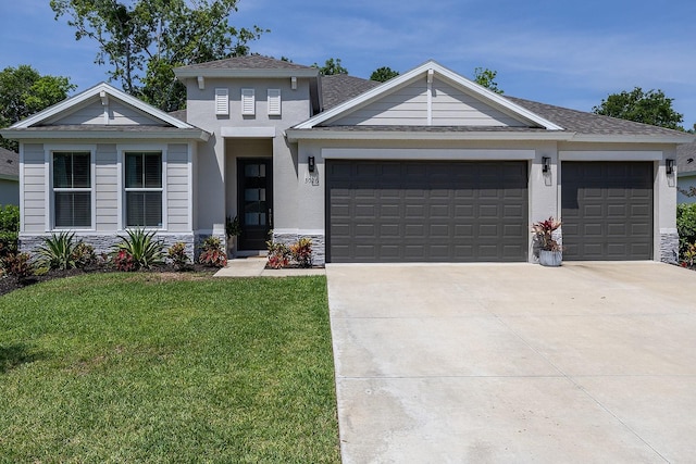 3026 Adrian Dr, Ormond Beach, FL 32174 - view of front facade featuring an attached garage, driveway, a front yard, stone siding, and roof with shingles