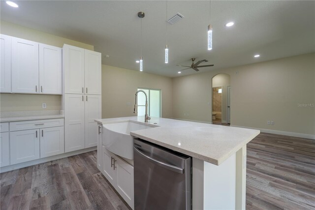 248 S Virginia Ave, Deland, FL 32724 - kitchen featuring dishwasher, arched walkways, a sink, wood finished floors, and recessed lighting