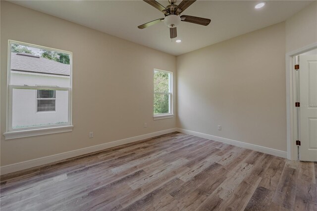 248 S Virginia Ave, Deland, FL 32724 - empty room featuring light wood-style floors, recessed lighting, ceiling fan, and baseboards