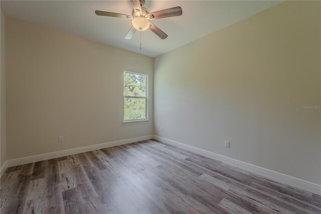 248 S Virginia Ave, Deland, FL 32724 - spare room featuring wood finished floors, baseboards, and ceiling fan