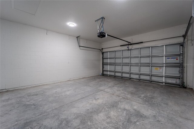 248 S Virginia Ave, Deland, FL 32724 - garage with a garage door opener and concrete block wall