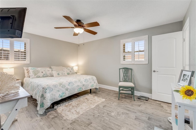 114 Ocean Aire Ter N, Ormond Beach, FL 32176 - bedroom with baseboards, wood finished floors, and ceiling fan