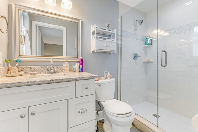 114 Ocean Aire Ter N, Ormond Beach, FL 32176 - full bathroom with a stall shower, toilet, and vanity