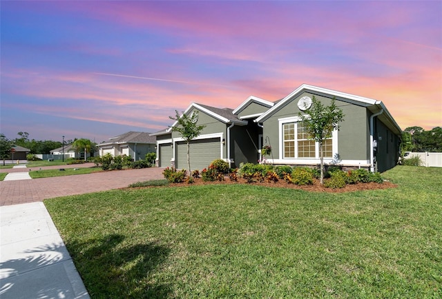 684 Stonebriar Dr SE, Palm Bay, FL 32909 - single story home featuring decorative driveway, stucco siding, and an attached garage