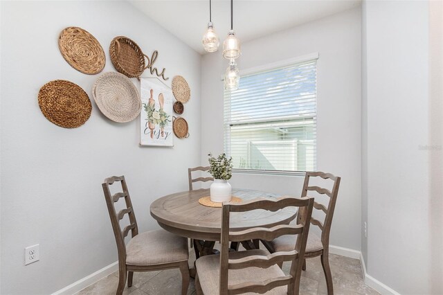 684 Stonebriar Dr SE, Palm Bay, FL 32909 - dining space with baseboards