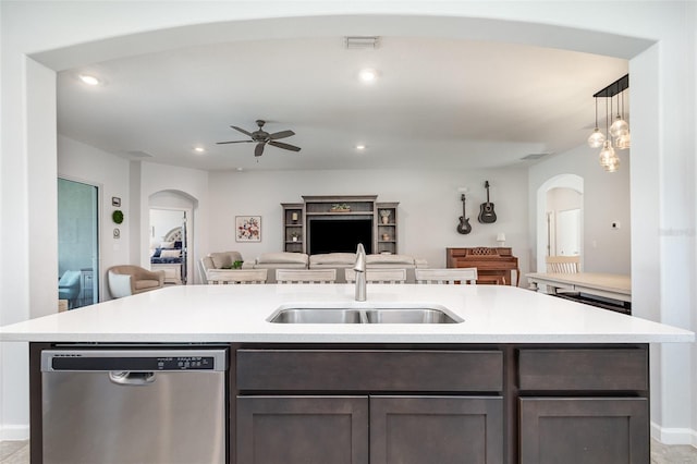 684 Stonebriar Dr SE, Palm Bay, FL 32909 - kitchen featuring dishwasher, arched walkways, open floor plan, a sink, and ceiling fan