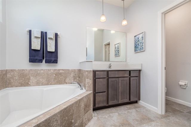 684 Stonebriar Dr SE, Palm Bay, FL 32909 - bathroom featuring vanity, a garden tub, toilet, and baseboards