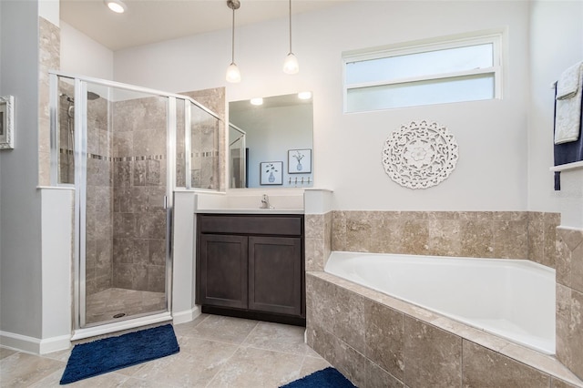 684 Stonebriar Dr SE, Palm Bay, FL 32909 - full bathroom with a garden tub, vanity, a stall shower, and baseboards