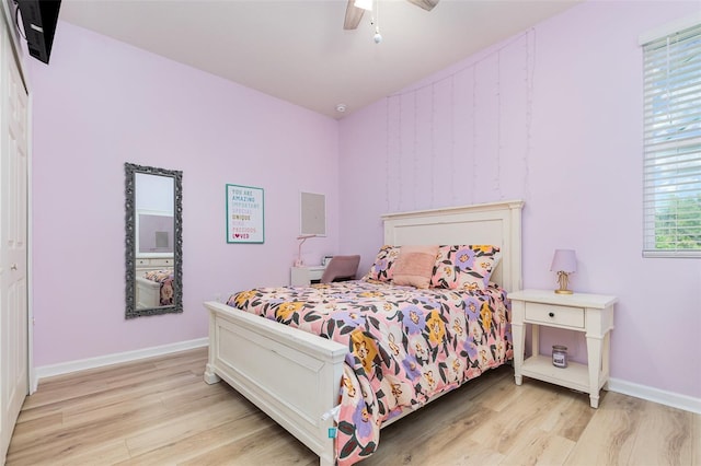 684 Stonebriar Dr SE, Palm Bay, FL 32909 - bedroom featuring light wood-type flooring, baseboards, and ceiling fan