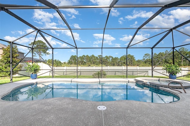 684 Stonebriar Dr SE, Palm Bay, FL 32909 - view of swimming pool with a fenced backyard, glass enclosure, a pool with connected hot tub, and a patio