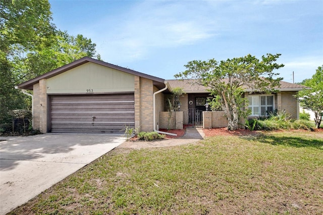953 Tulip St, Deltona, FL 32725 - ranch-style home with brick siding, a garage, concrete driveway, and a front lawn