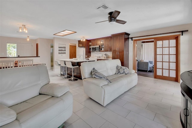 953 Tulip St, Deltona, FL 32725 - living room featuring a ceiling fan and light tile patterned floors