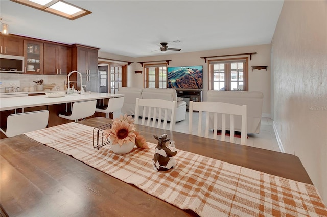 953 Tulip St, Deltona, FL 32725 - dining room with ceiling fan and baseboards
