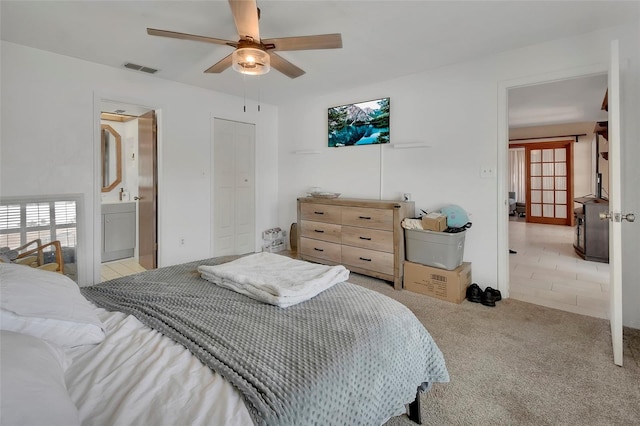 953 Tulip St, Deltona, FL 32725 - carpeted bedroom featuring ceiling fan, a closet, and connected bathroom