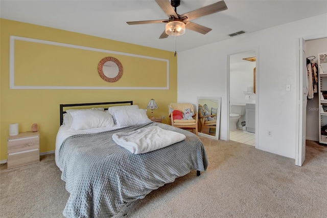 953 Tulip St, Deltona, FL 32725 - carpeted bedroom with a walk in closet, a closet, ensuite bathroom, and ceiling fan