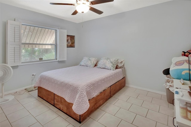 953 Tulip St, Deltona, FL 32725 - bedroom with baseboards, a ceiling fan, and light tile patterned floors