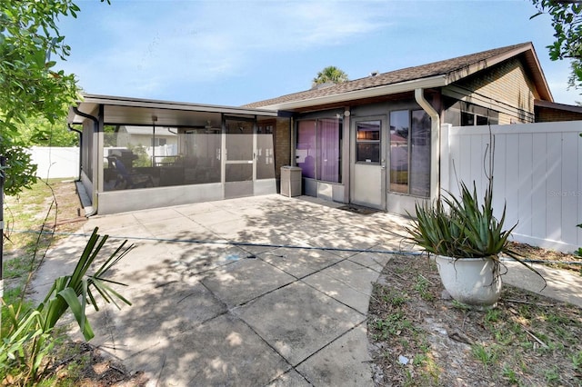 953 Tulip St, Deltona, FL 32725 - back of property featuring a sunroom and a patio area