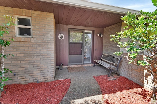 953 Tulip St, Deltona, FL 32725 - view of exterior entry featuring brick siding