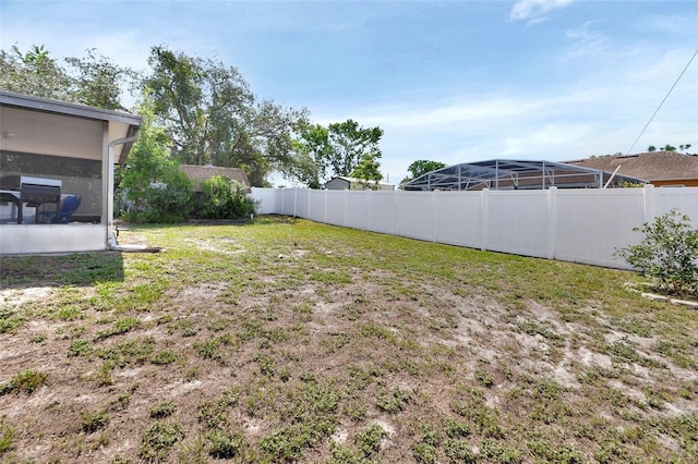 953 Tulip St, Deltona, FL 32725 - view of yard featuring a sunroom