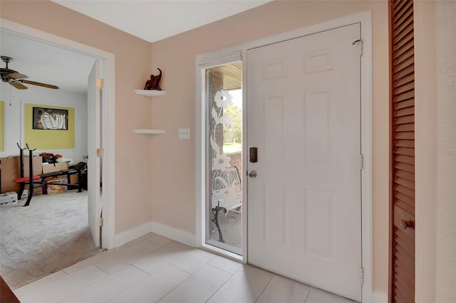 953 Tulip St, Deltona, FL 32725 - foyer with a ceiling fan, baseboards, and light colored carpet