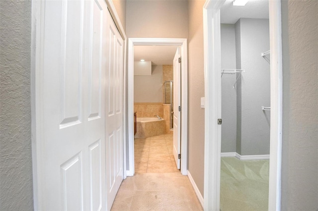 201 Dyson Dr, Deland, FL 32724 - corridor with light carpet, baseboards, and light tile patterned floors