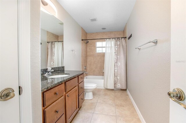 201 Dyson Dr, Deland, FL 32724 - bathroom featuring tile patterned floors, vanity, toilet, and shower / bath combo