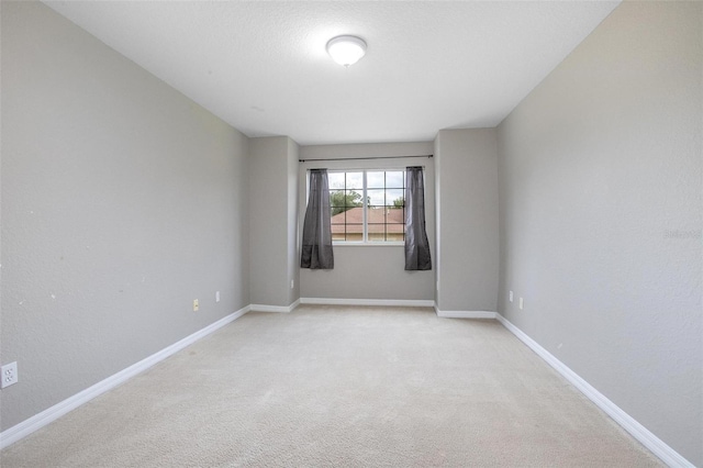 201 Dyson Dr, Deland, FL 32724 - spare room with light carpet and baseboards